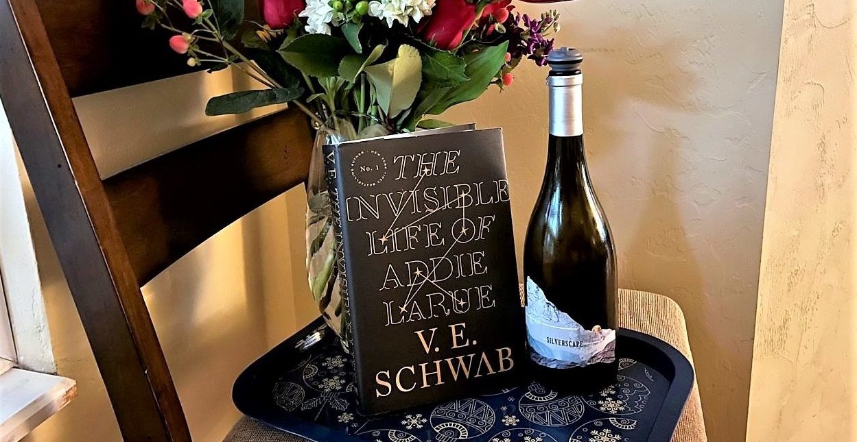 addie larue books bordeaux title image with wine and book